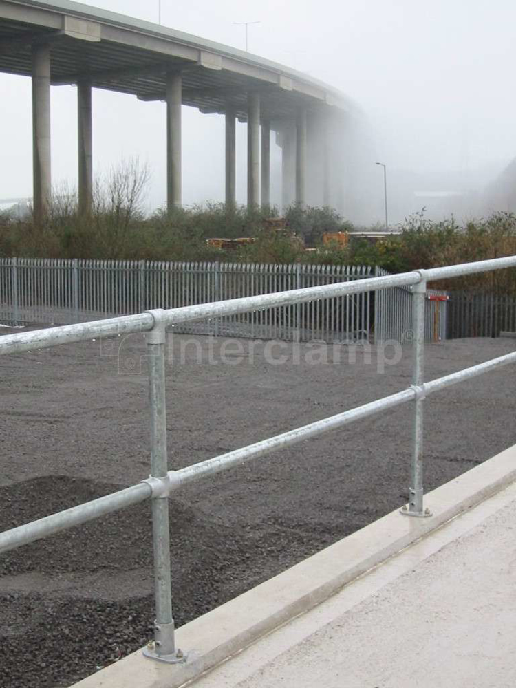 Civic recycling facility showcasing safety guardrails made with Interclamp pipe clamp fittings and tubes, providing a safe environment for waste disposal.